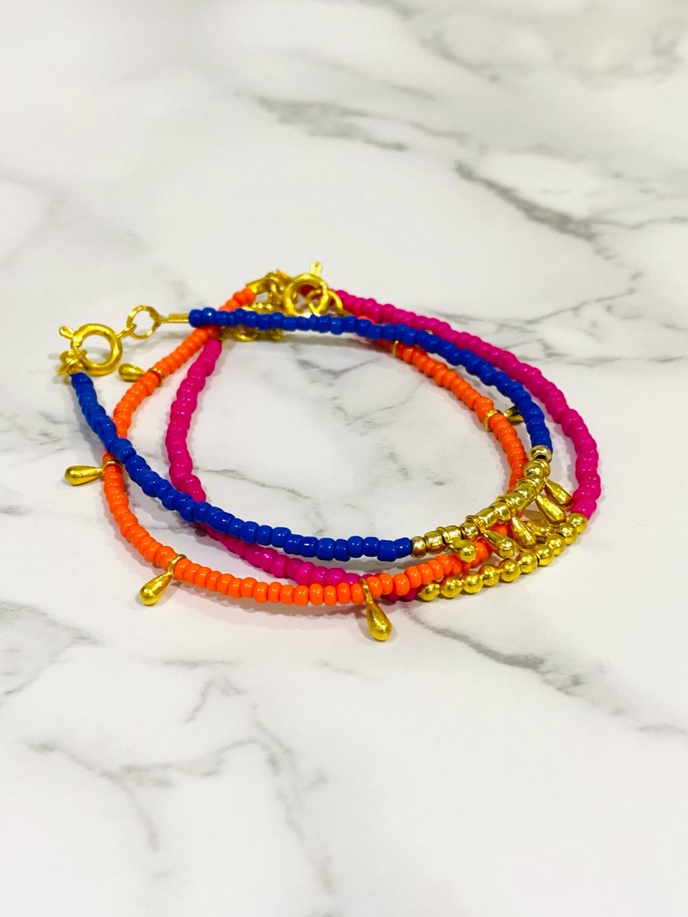 Set of 3, Handmade Beaded Bracelets in Orange, Pink, and Blue with Gold Details